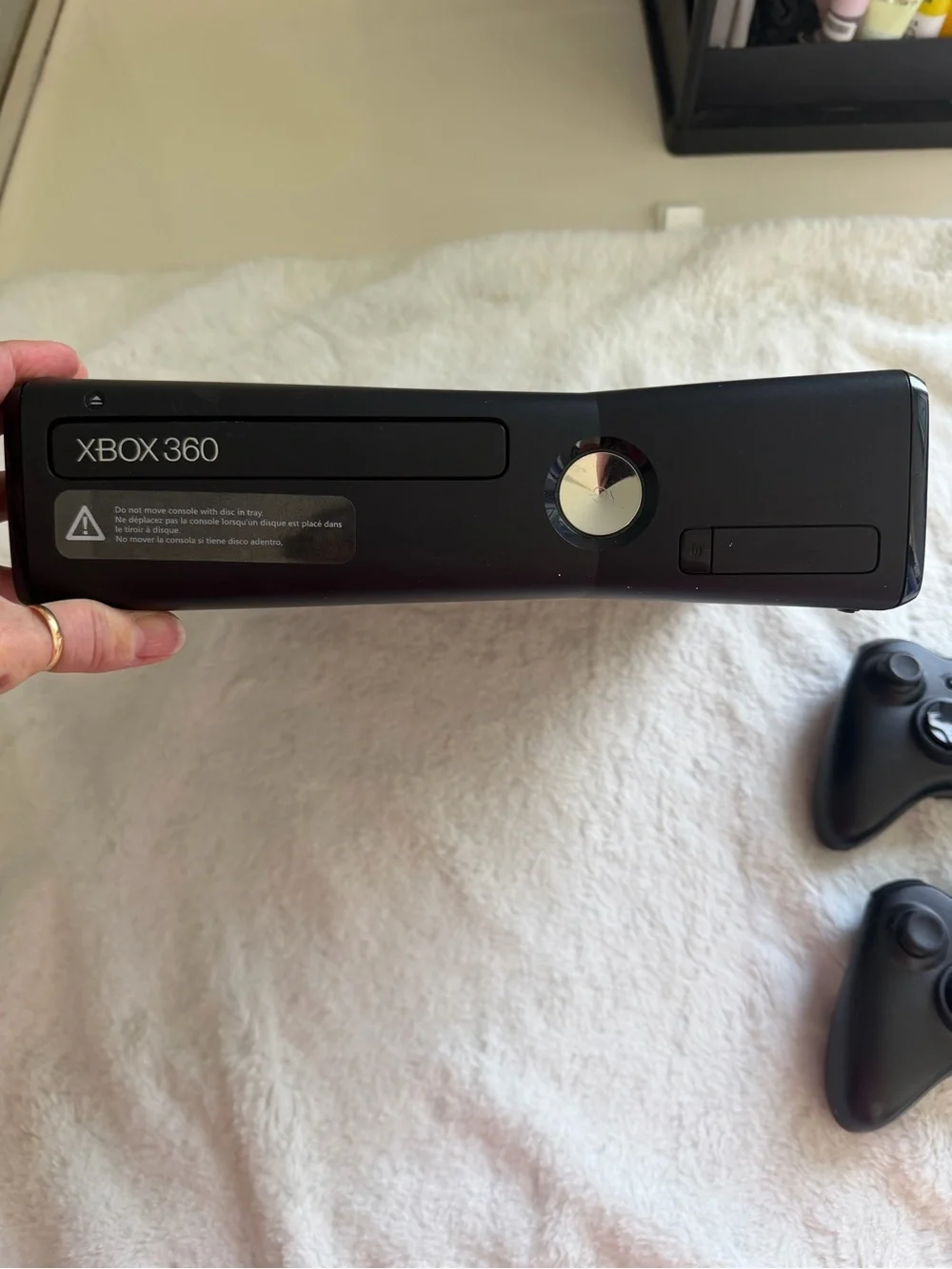 Microsoft Xbox 360 Slim Console with Two Black Wireless Controllers